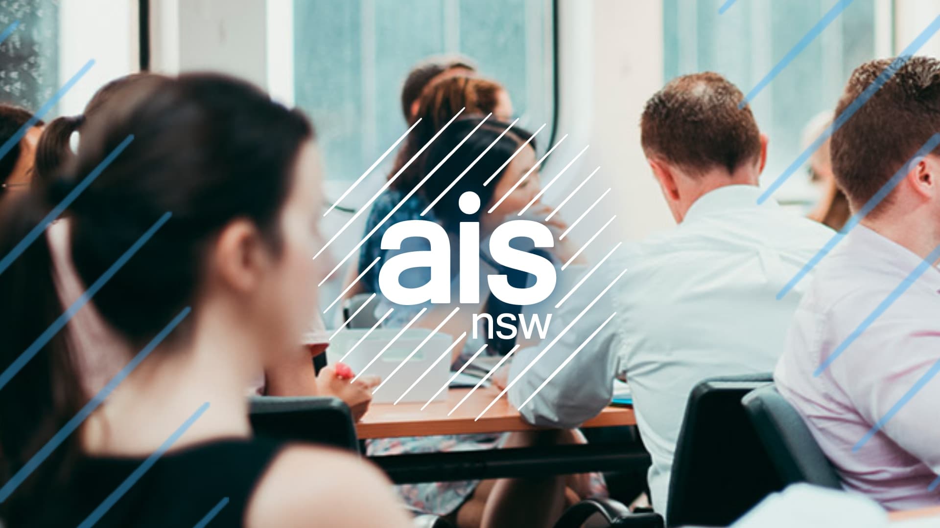 AIS NSW logo super-imposed over a photo of a classroom of adult students